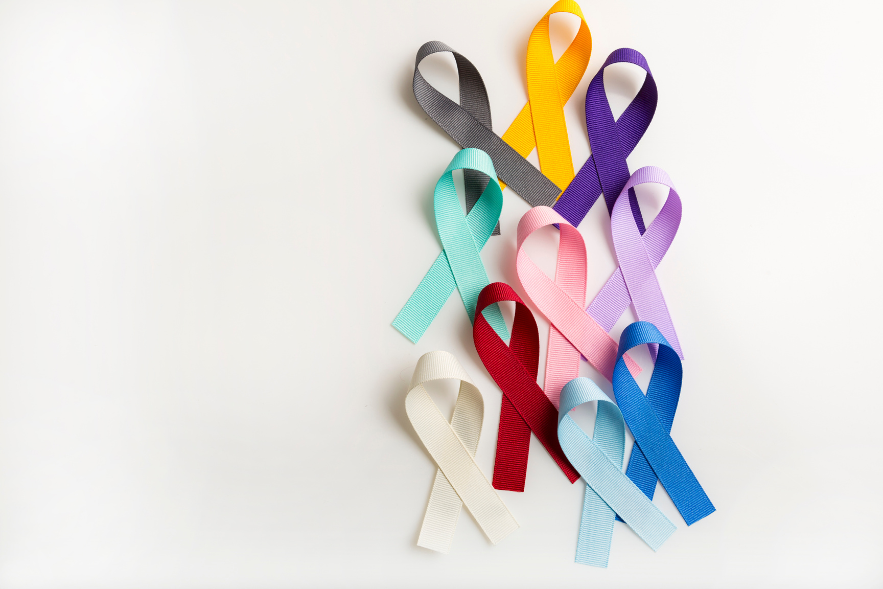 Multi colored cancer ribbons Proudly worn by patients, supporters and survivors for world cancer day. Bringing awareness to all types of cancer